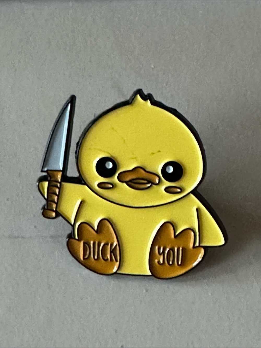Cute Yellow Duck Enamel Pin Holding Knife